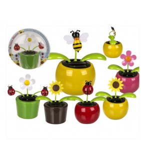 Flor con movimiento & insecto en maceta